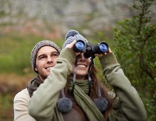 Image showing Couple, love and binocular in nature for travel, adventure or hiking journey and explore together in eco friendly mountains. Happy man and woman trekking with outdoor search, vision or birdwatching