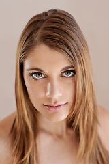 Image showing Beauty, makeup and portrait of young woman in studio with natural, glow and facial routine. Confidence, cosmetics and female person with self care, dermatology and face treatment by brown background.