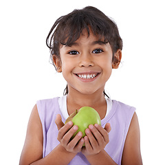Image showing Portrait, apple or happy child in studio with nutrition, wellness or healthy diet isolated on white background. Food, fiber or face of a young girl giving natural fruits for vitamin c with smile