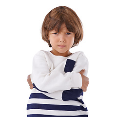 Image showing Boy, child and angry in portrait with arms crossed, frustrated and stress, emotion and frown on white background. Youth, upset or disappointed with tantrum, bad attitude with problem in studio