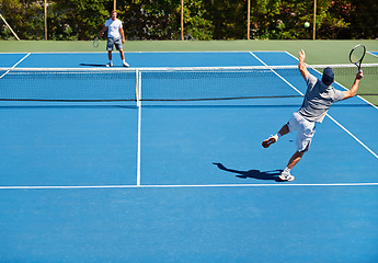 Image showing Tennis, game and men with fitness, friends and competition with training and exercise with sunshine. Players, tournament and guys with rackets and court with workout and challenge in the summer