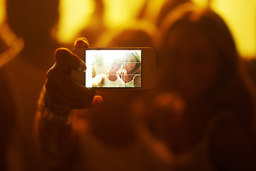 Image showing Friends, women and selfie with phone screen, party or happy in portrait, nightclub or web blog. Girl, people and smartphone for photography, memory or profile picture at concert, rave or social media