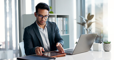 Image showing Business man, laptop and tablet for data analytics, stock market and online research for profit, sales or company account. Asian trader, investor or analyst in office on digital tech and computer