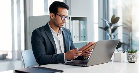 Image showing Data analysis, research and businessman with a tablet and laptop for accounting or economy growth. Office, Asian and financial worker with technology for email, planning or information on a website