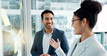 Image showing Business man, woman and planning by glass board, point and talk with thinking, notes and problem solving. Corporate partnership, brainstorming and discussion with moodboard, decision and solution