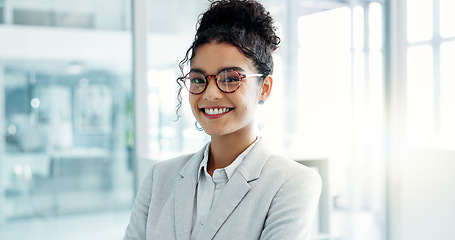 Image showing Face, business and woman with a smile, office and arms crossed with a career, consultant and entrepreneur. Portrait, person or employee with glasses, workplace or agent with ambition or administrator