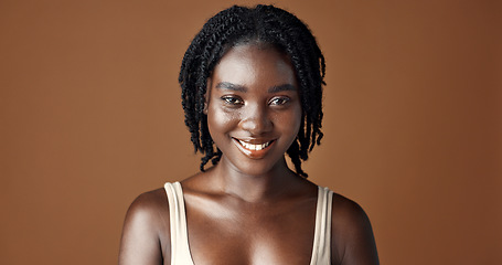 Image showing Face, beauty and aesthetic with funny black woman in studio isolated on brown background for wellness. Portrait, skincare and laughing for natural cosmetics or foundation with confident young person
