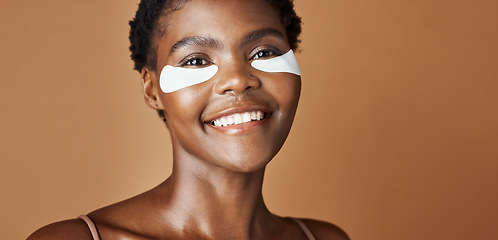 Image showing Skincare, beauty and face of black woman in studio with glowing, natural and facial routine. Smile, cosmetic and portrait of African female person with dermatology treatment by brown background.