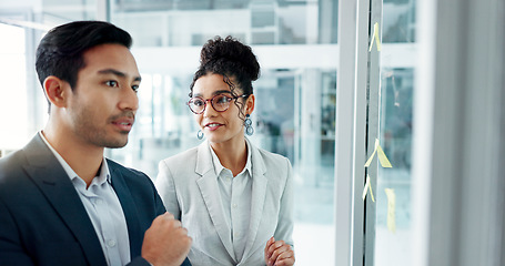 Image showing Business people, planning and glass board with point, talk and thinking with notes for problem solving. Partnership, man and woman with brainstorming, reading and moodboard with decision for solution