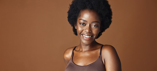 Image showing Face of black woman, afro model or natural beauty for wellness, cosmetics or healthy skin in studio. Dermatology, pride or serious African person with glow or skincare results on brown background