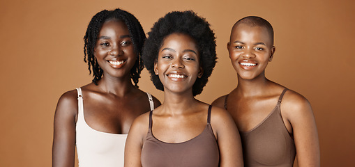 Image showing Face, beauty and wellness with black woman friends in studio on a brown background for natural aesthetic. Portrait, skincare and smile with a group of african people looking happy or satisfied