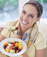 Image showing Healthy food, woman in portrait with fruit in salad and diet, organic breakfast and relax on sofa with smile for weight loss. Vegan meal, gut health and wellness, eating for nutrition with vitamins