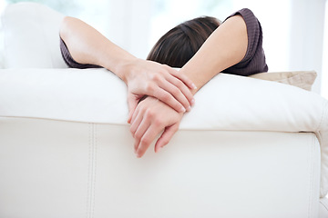 Image showing Relax, sofa and hands of woman in living room for resting on weekend, free time and break in home. Apartment, house and person lying, comfortable and chill on couch for peace, calm and wellness