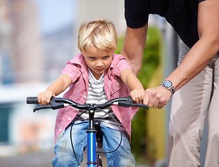 Image showing Father, bike and teaching child to ride in outdoor, bonding together and wellness with childhood development. Parent, son and fun in nature for learning bicycle, love and care for cycling on vacation