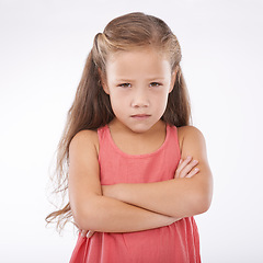 Image showing Portrait, unhappy and girl child arms crossed in studio on white background with anger and frustration. Problem, tantrum or moody and young kid with bad attitude looking upset at mistake or error