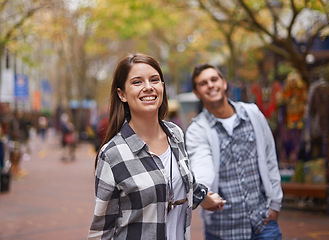 Image showing Happy couple, portrait and woman walking, holding hands and lead partner on city journey, morning trip or tour of urban Paris. Love, tourism town and people bonding together on relax commute