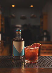 Image showing Negroni cocktail with dried orange slice