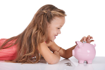 Image showing Girl child, piggy bank and coins for saving, studio or thinking with smile for investing by white background. Confused kid, container or animal toys for money, cash or happy for financial education