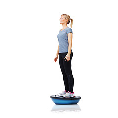 Image showing Woman, ball and standing in fitness for balance, exercise or workout on a white studio background. Young active female person or athlete on half round object for health and wellness on mockup space