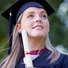 Image showing Happy woman, student and certificate in graduation for qualification, education or career ambition. Face of female person or graduate smile in diploma, degree or award with vision at outdoor ceremony