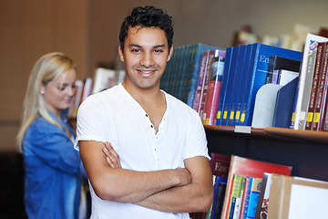 Image showing College, arms crossed or portrait of happy man in a library for knowledge or school for future. Scholarship, education or male student with smile, joy or pride for studying or learning in campus