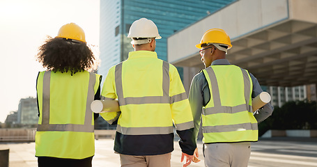 Image showing People, back and architect team walking in city for construction, maintenance or building on site. Rear view of employee group, engineer or contractor in teamwork for architecture project or plan