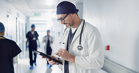 Image showing Man, doctor and tablet for hospital, healthcare or clinic research, online planning and schedule management. Medical professional or surgeon typing on digital technology for surgery results or data