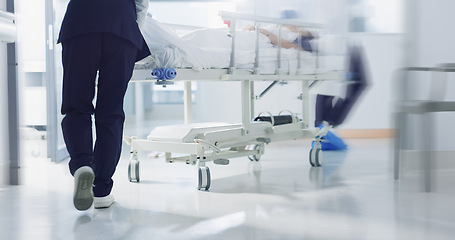 Image showing Healthcare, doctor and rush bed in hospital for surgery, emergency or medical problem in corridor. Medicine, professional and nurse feet with stretcher for wellness, service and risk in clinic or job