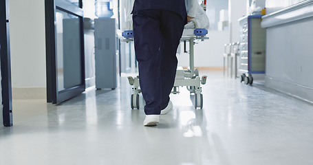 Image showing Nurse, feet and walking patient in hospital, bed or steps in hallway or corridor to surgery, operation room or ER healthcare. Doctor, moving and pushing person in clinic to ICU, bedroom or walk