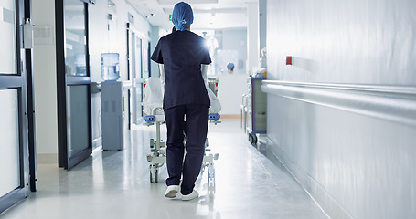 Image showing Patient, bed and nurse walking in hospital, hallway or corridor to surgery, operation room or ER healthcare service. Doctor, moving and pushing person in clinic to ICU, bedroom or walk backward