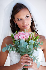 Image showing Woman, flower bouquet and wedding dress or marriage event, love promise or diamond ring. Female person, daydreaming and gown or floral romance or partnership bride or commitment, elegant or thinking