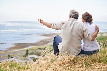 Image showing Old couple and pointing at nature on holiday, vacation or embrace with love or support in retirement. Back, man and woman together sightseeing on hill at beach or relax in environment and adventure