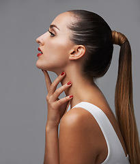 Image showing Woman, hair and beauty with profile in studio, cosmetics and manicure for glamour on grey background. Color nails, red lipstick and skin with shine, makeup and keratin treatment with haircare