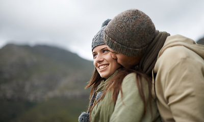 Image showing Couple, kiss and love on hike in nature together, bonding and romance in outdoors on mountain. Winter, people and security and connection in relationship or marriage, holiday and trekking adventure