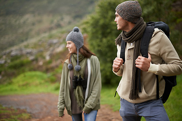 Image showing Couple, happy and hiking in mountain or forest with travel, adventure or nature for wellness or fitness. Man, woman and trekking outdoor in woods for cardio, exercise or workout with view or backpack