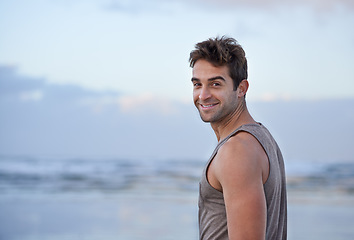 Image showing Portrait, smile and beach with man, vacation and happiness with journey and getaway trip. Face, person and guy with holiday, Brazil and adventure with peace and travel with wellness, summer and ocean