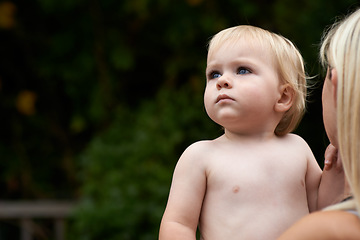 Image showing Baby, curiosity and mother outdoor for development with love, mockup or early childhood in backyard of home. Toddler, child and relax for wellness, milestone and exploring with innocence and bonding