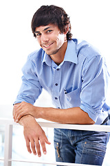 Image showing Portrait, happy and man with confidence in career and railing in workplace for developer. Person, smile and face of entrepreneur with positive in start up company and it professional with job growth