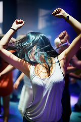 Image showing Woman, dancing and music at rave, happy and party in nightclub, festival and dj event. Disco, rock and freedom with excited girl in crowd of fans for celebration, energy and techno performance