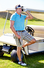 Image showing Man, phone call and golf cart on course for communication at sports training for professional player, talent or skill. Mature person, digital device and club on grass for weekend chat, hobby or pro