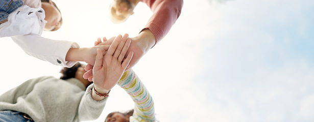 Image showing Family, hands together and team in solidarity below for collaboration or celebration under sky. Low angle of mother, father and kids piling for teamwork motivation, support or coordination together