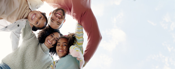 Image showing Face, happy family and bottom hug outdoor for care, love or bonding on vacation, holiday and low angle. Smile, portrait of parents and children embrace together, having fun or enjoying quality time