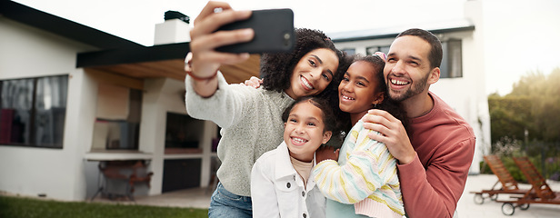 Image showing Children, family and selfie outdoor with a smile, love and care in home backyard. Young latino woman and man or parents hug happy girl kids for a profile picture or social media post on holiday