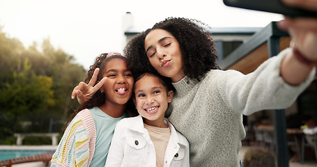 Image showing Family, selfie and children outdoor with a smile, love and care in home backyard. Face of young latino woman, woman or parent for a picture with happy kids for social media post or profile picture