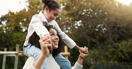 Image showing Mother, daughter and piggyback walking in park or garden for fun bonding, holiday or weekend outside. Happy mom carrying her child on shoulders for family time together in nature or forest by house