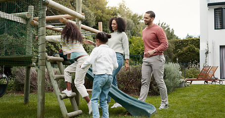 Image showing Family, running and children outdoor in backyard for playing, happiness and bonding at home. Young latino woman, man and happy kids at a playground while on holiday or vacation for a fun activity