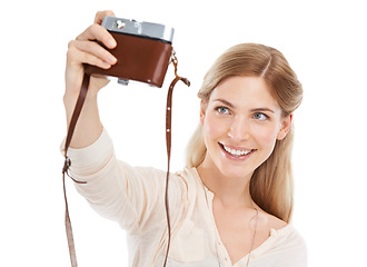 Image showing Camera, selfie and happy woman in studio with fun hobby, memory or photoshoot on white background. Lens, face or female model smile for self portrait with vintage, retro or photography equipment