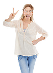 Image showing Portrait, tongue and peace sign with excited woman in studio isolated on white background for humor. Emoji, energy or comedy and confident young comic feeling silly or goofy with weird body language