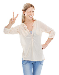 Image showing Smile, peace sign and woman wink in portrait at studio isolated on a white background. Girl blink, fingers and v hand gesture, emoji and young female model with symbol for victory, success or winning
