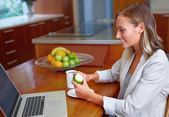 Image showing Laptop, apple and business woman in home for morning routine for wellness, nutrition and healthy breakfast. Remote work, freelancer and person with fruit on computer for internet, website or research